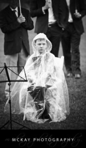 Boy sitting in rain unhappy weather rain
