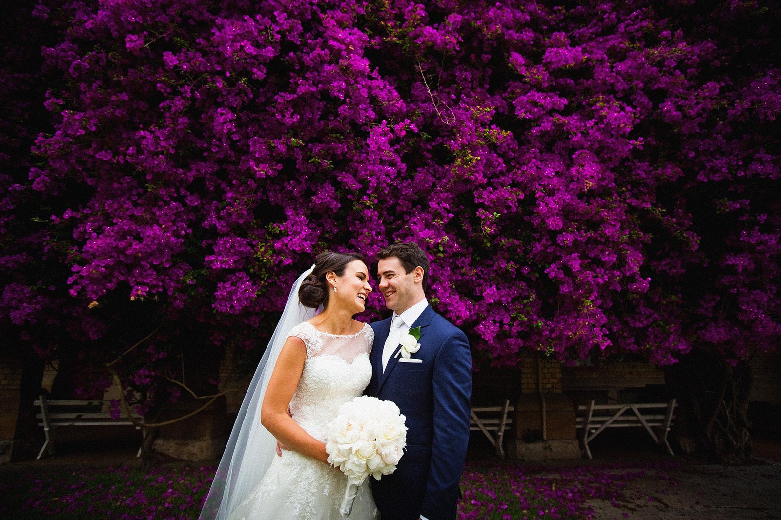 bride groom laughing purple flowers Riverview wedding