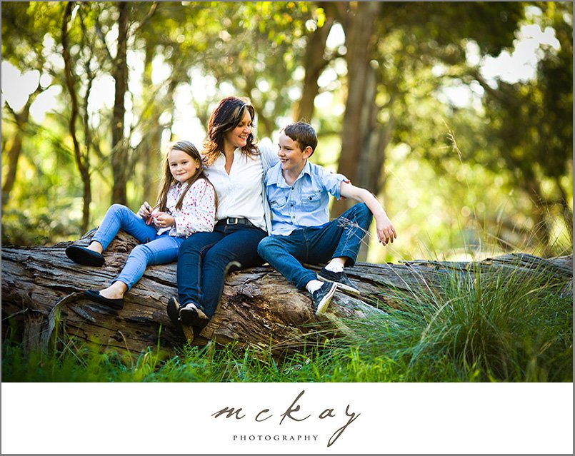 bowral family photo on a fallen gum tree