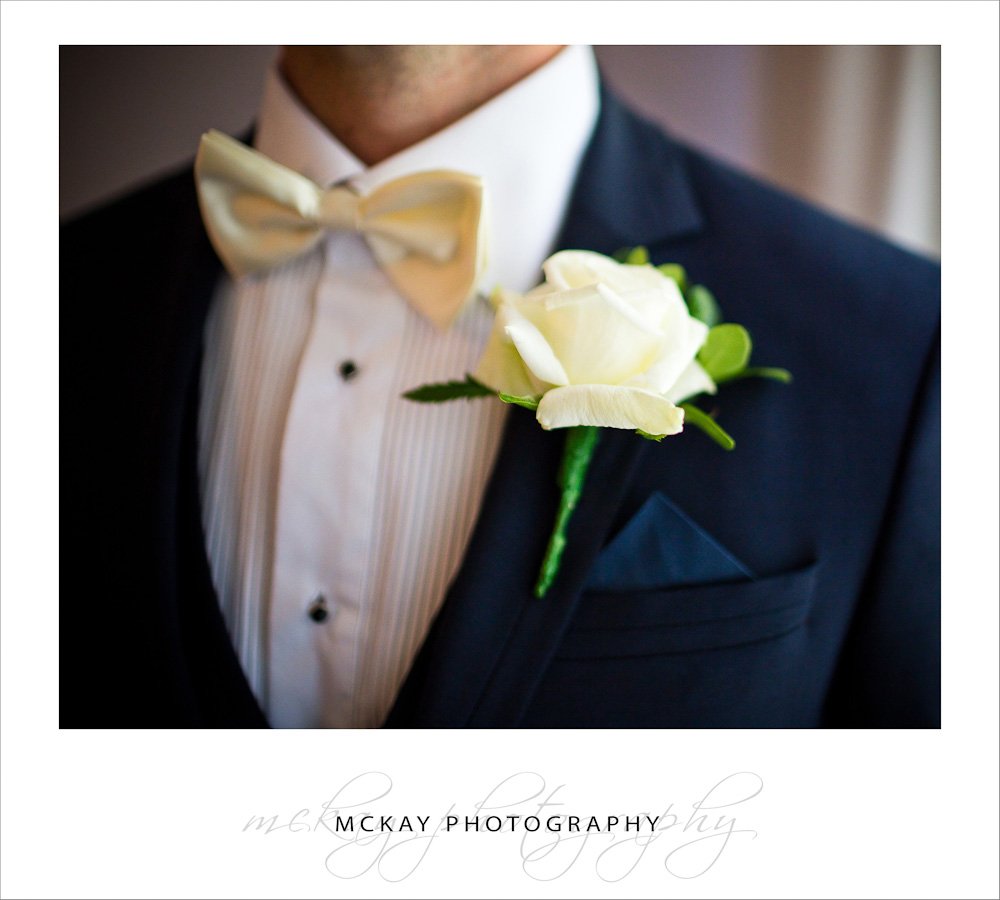 close up groom details bow tie
