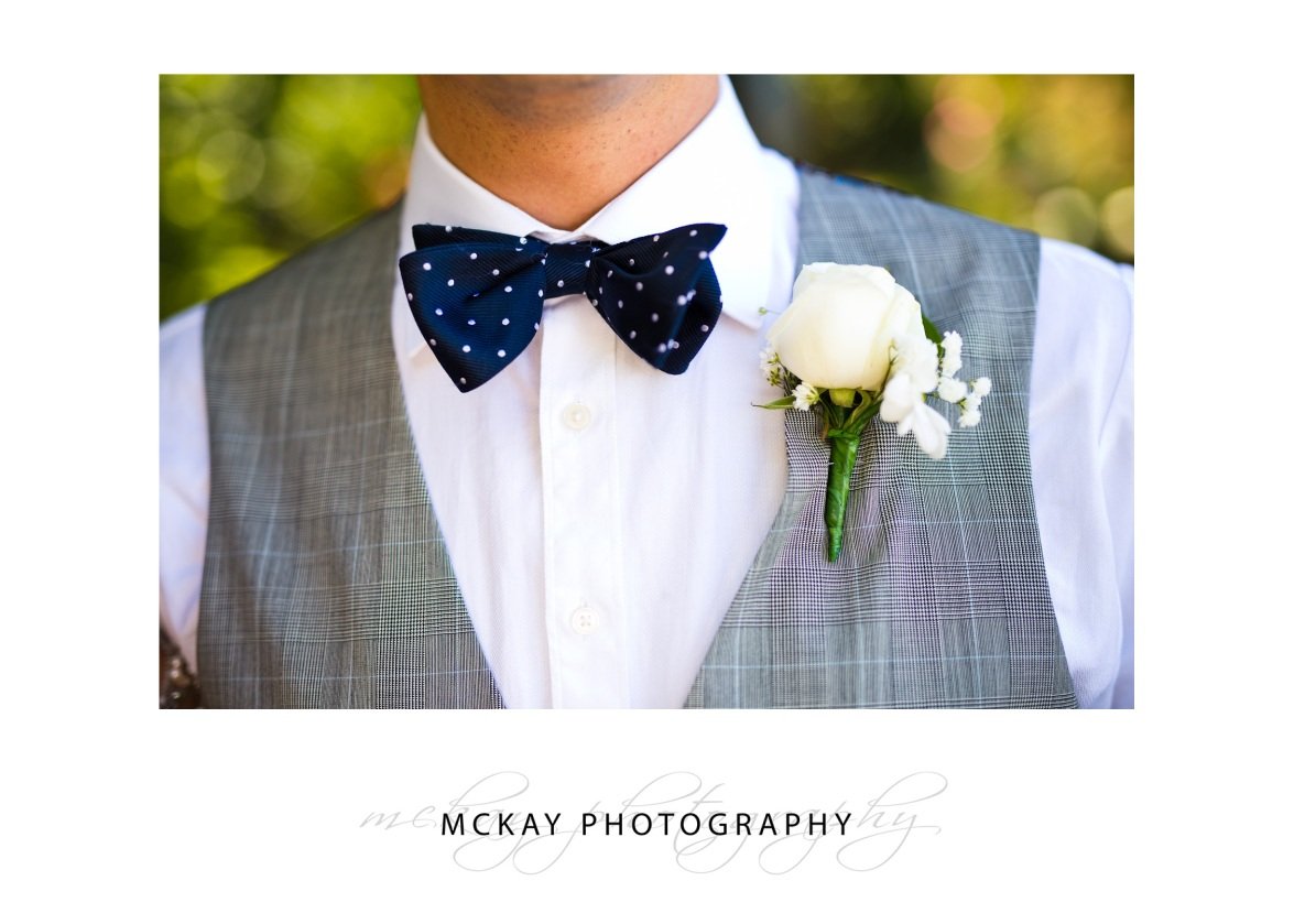 groom bow tie and flower detail