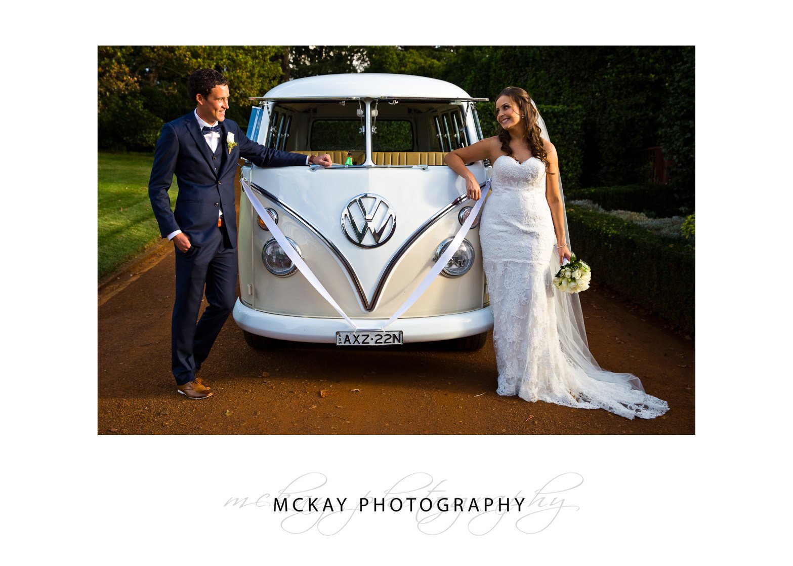 Bride and groom and combi wedding car