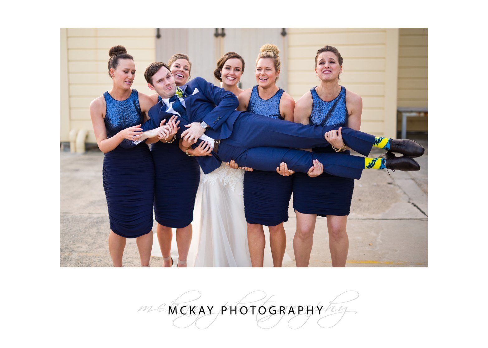 Ed lifted by bridesmaids