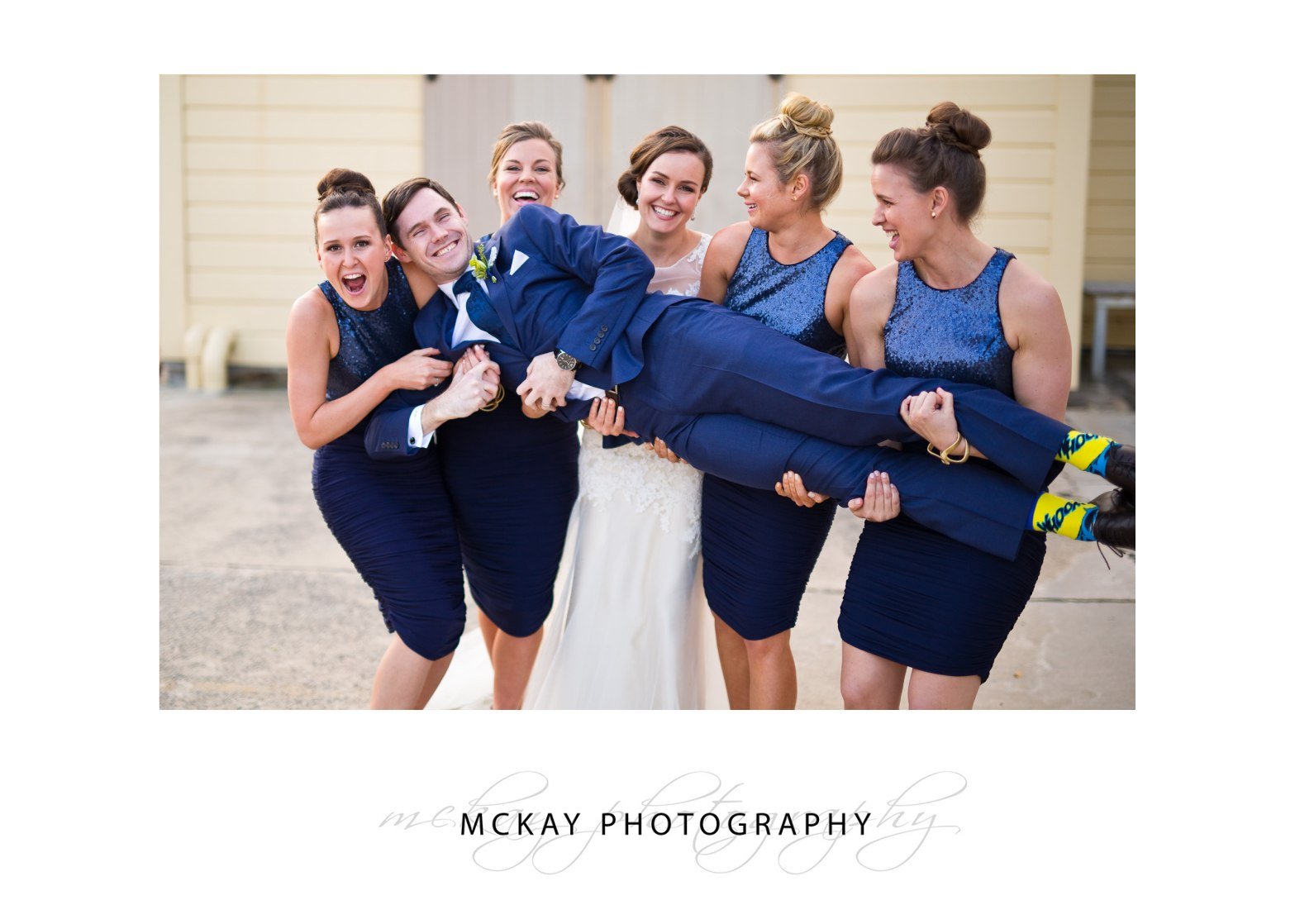 Ed lifted by bridesmaids