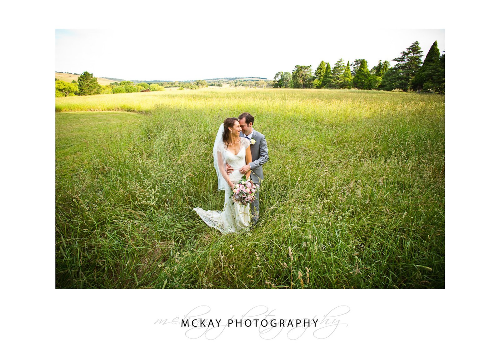 Grass field wide shot wedding photo