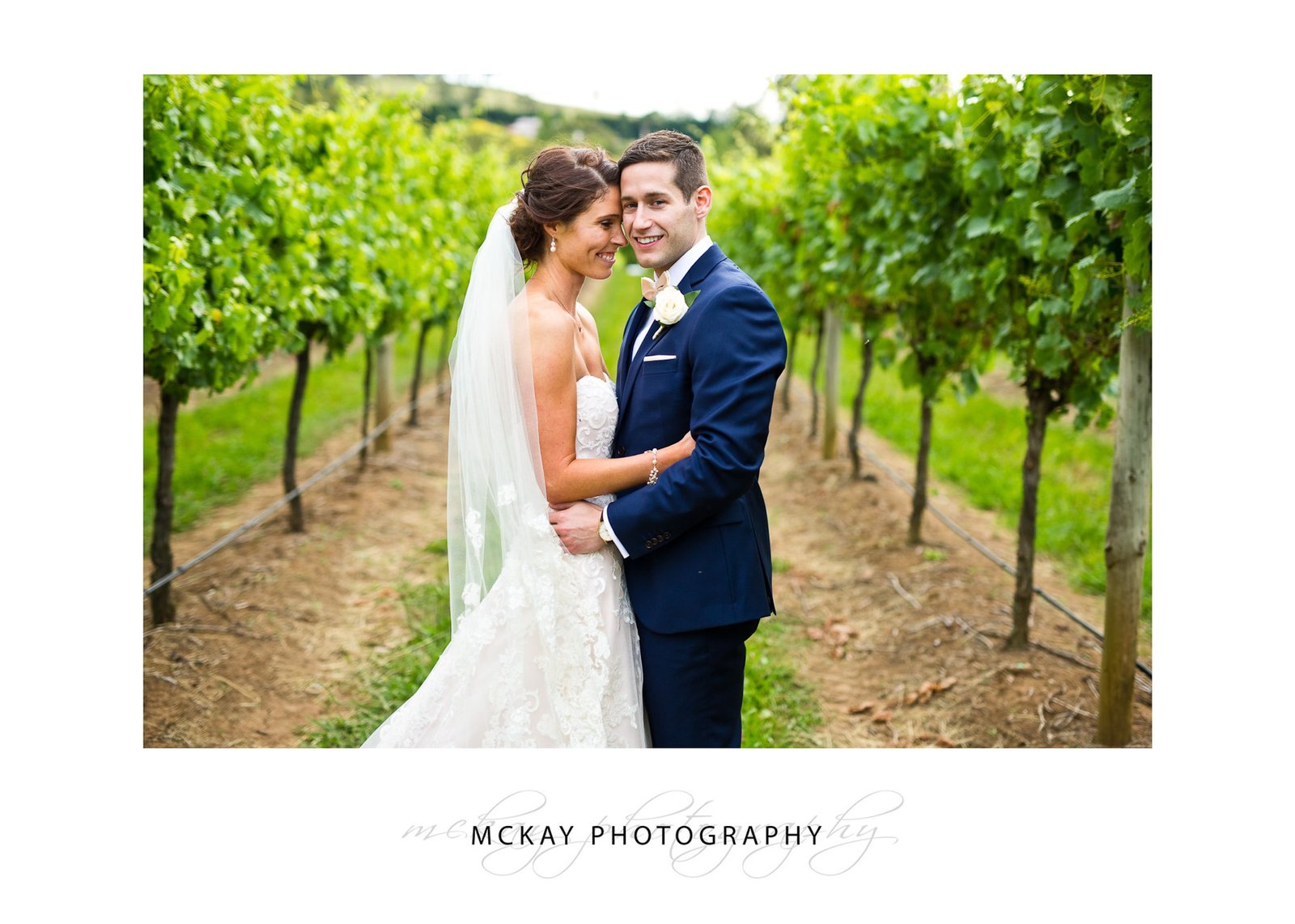 Holly & Jeff in the grape vine rows