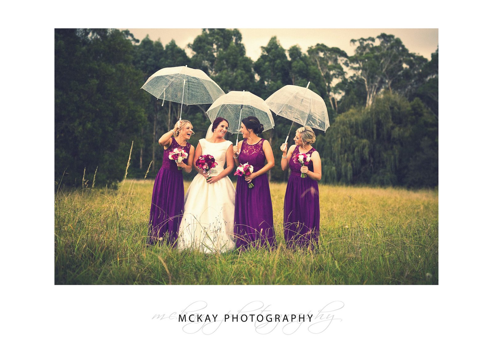 Bridesmaids umbrellas rain wedding Bowral grass field