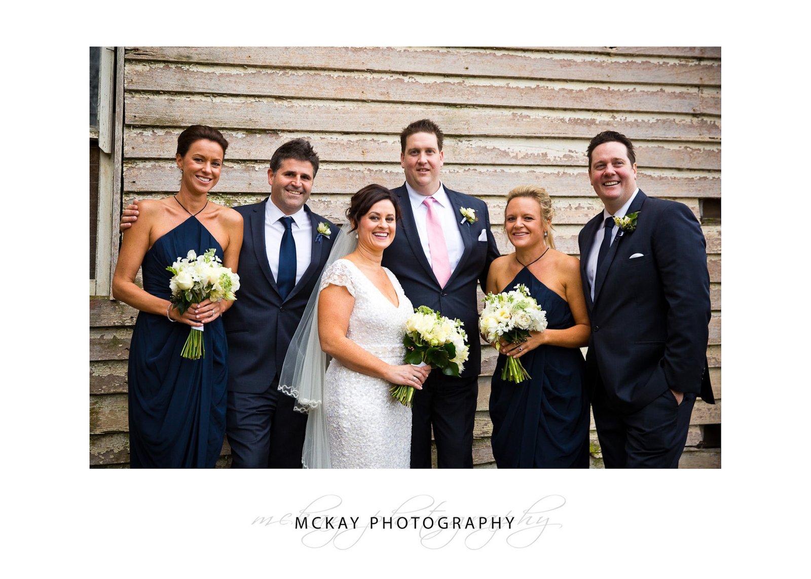 Bridal party photo against old weatherboard barn Bowral