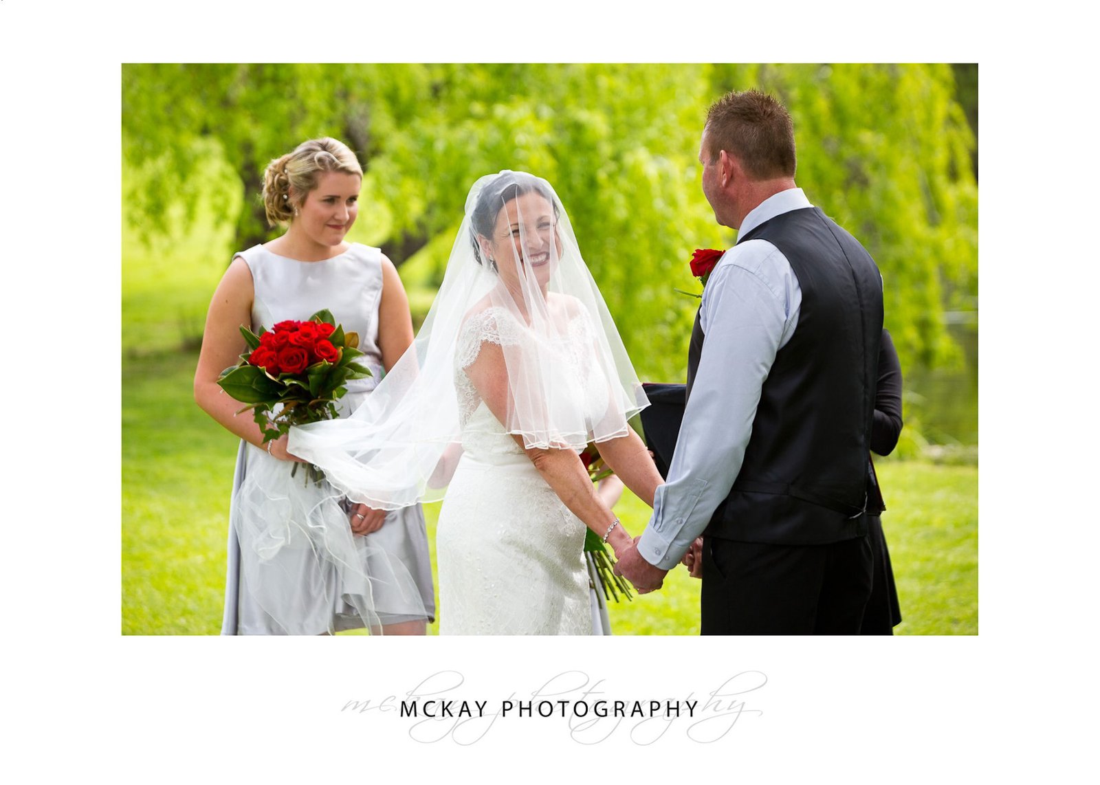 Bride smiling during wedding ceremony at Briars