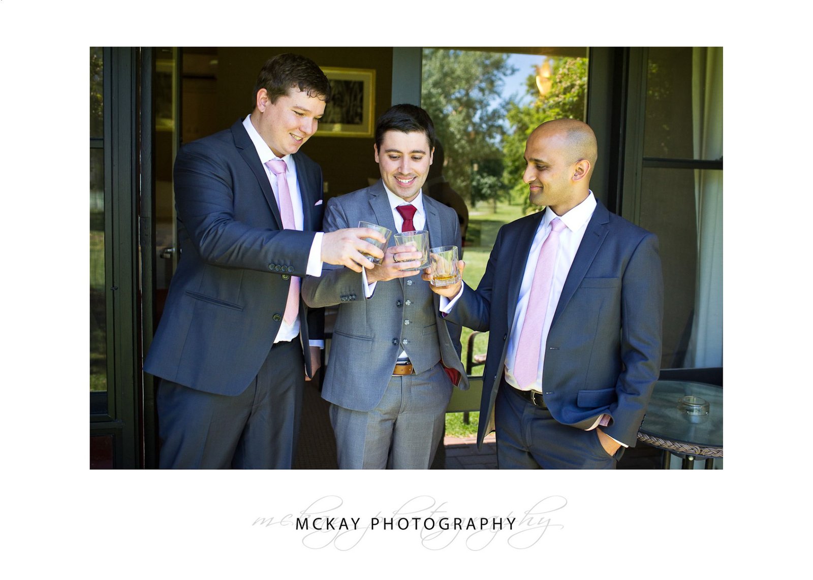 Boys drinking scotch wedding drinks