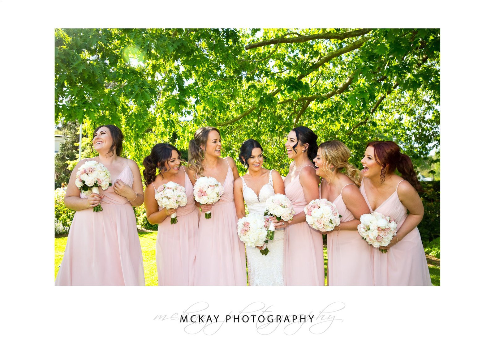 All the girls laughing under tree leaves Bowral wedding