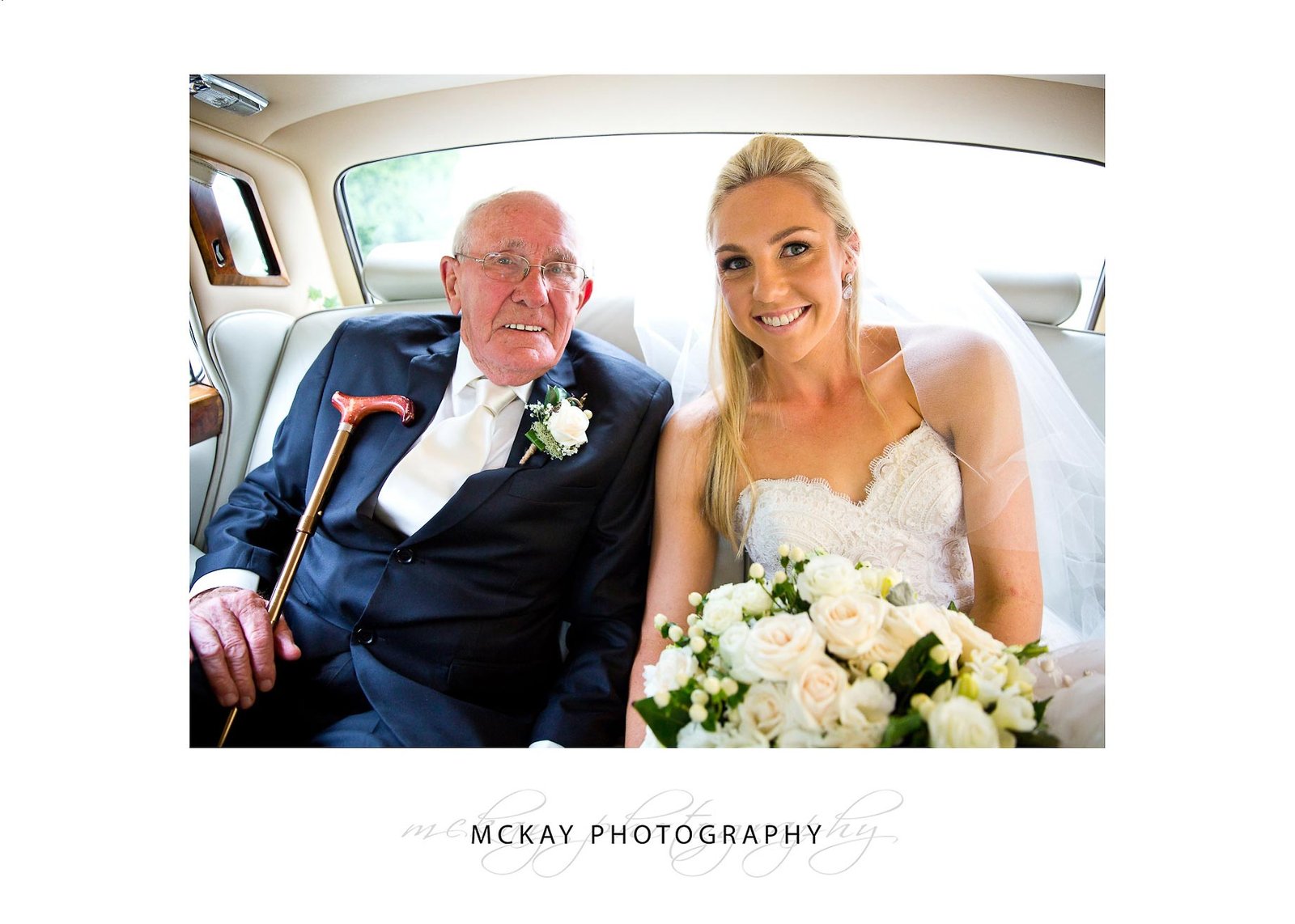 Bride and grandfather in wedding car
