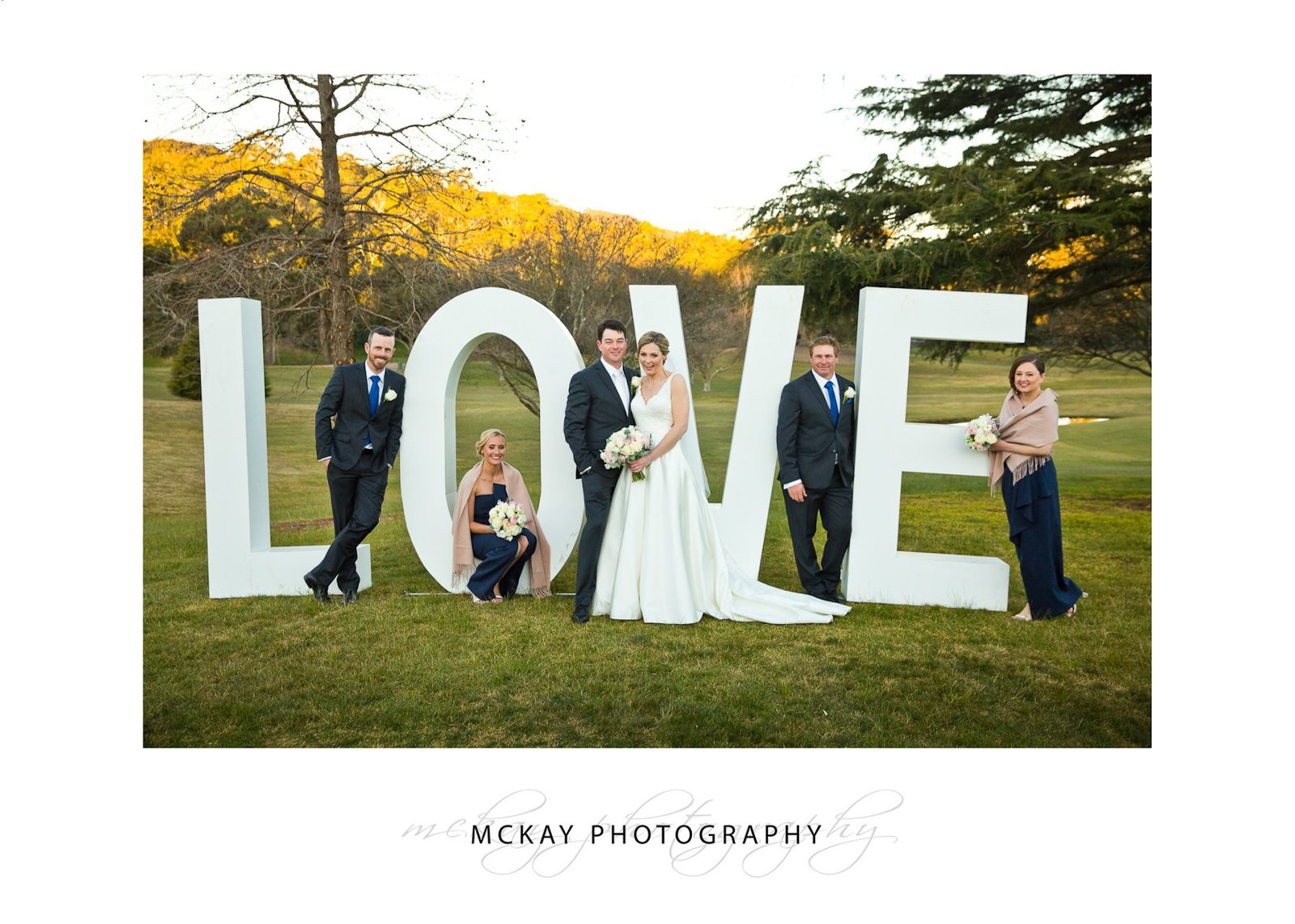 Bridal party and LOVE sign letters